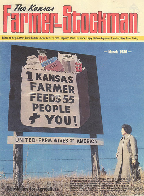 Jeanne with 'One Kansas Farmer Feeds' sign